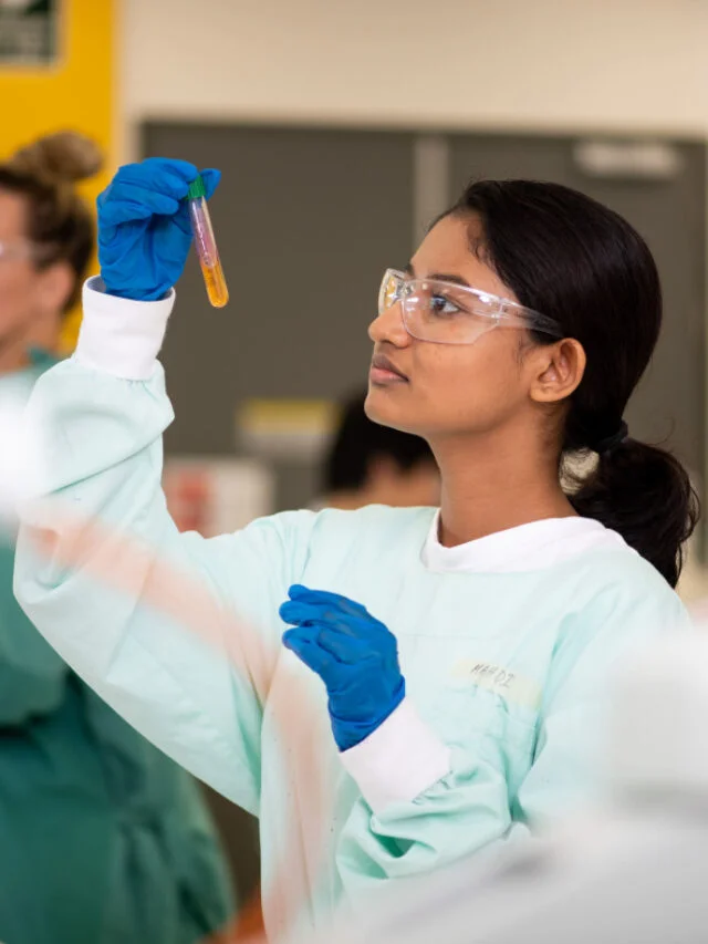 A captivating image of a student conducting research in a laboratory at Charles Darwin University